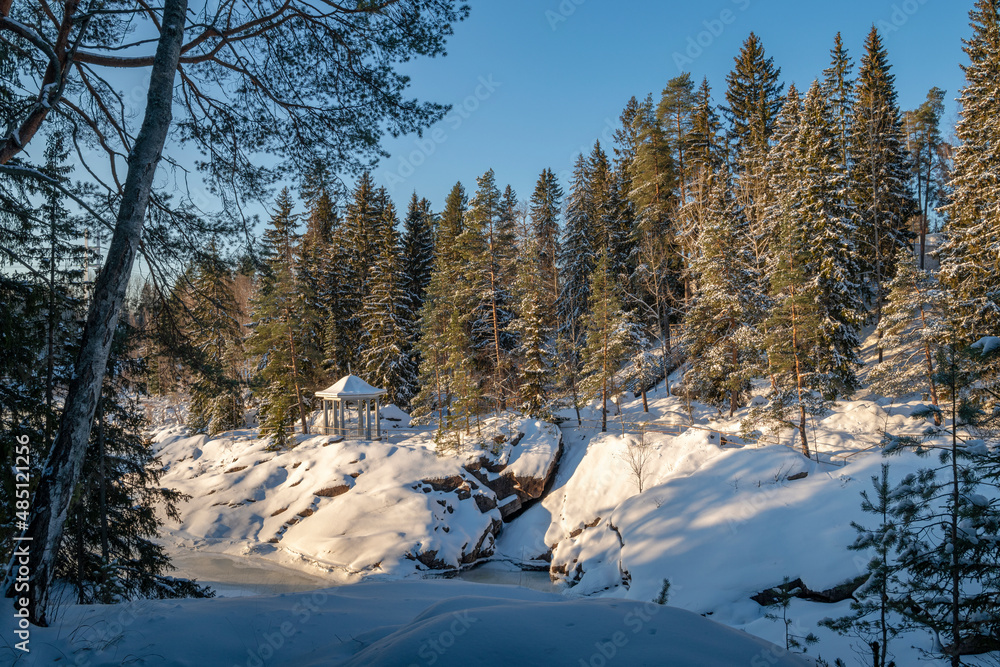 View of the pavilion and the bank of The Vuoksi River, Imatrankoski, Mellonlahti nature trail in winter, Imatra, Finland View of the pavilion and the bank of The Vuoksi River, Imatrankoski, Mellonlahti nature trail in winter, Imatra, Finland