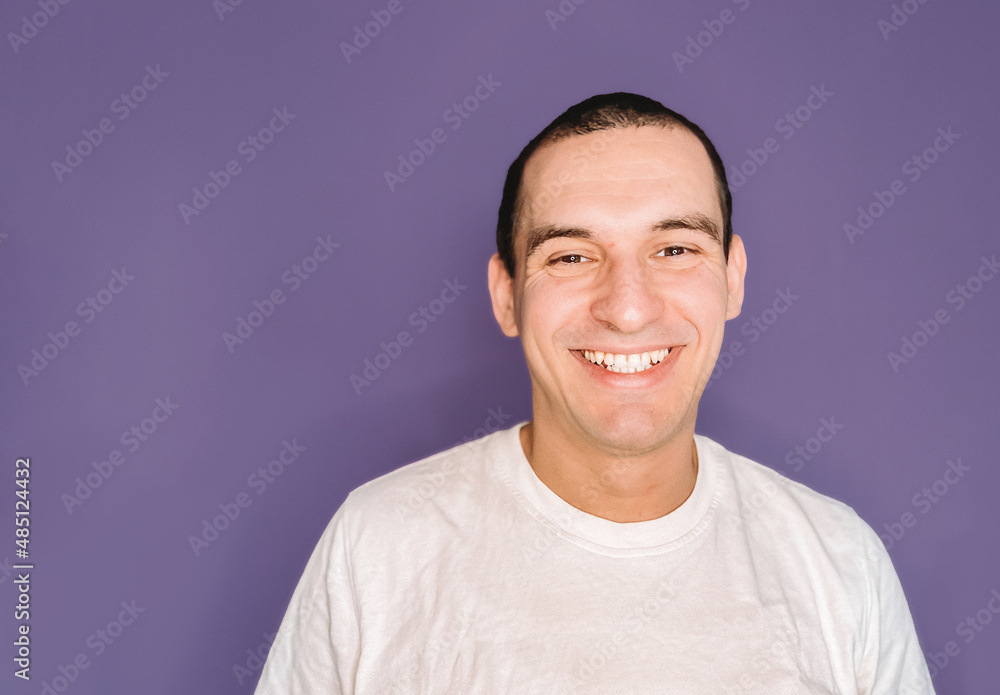 Portrait of a caucasian man smiling and happy isolated on color of the year 2022 very peri Portrait of a caucasian man smiling and happy isolated on color of the year 2022 very peri