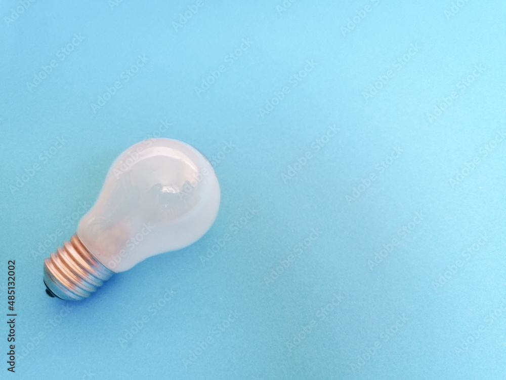 light bulb on blue background light bulb on blue background