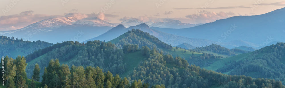 Evening haze in the mountains. Spring landscape. Panoramic view. Evening haze in the mountains. Spring landscape. Panoramic view.