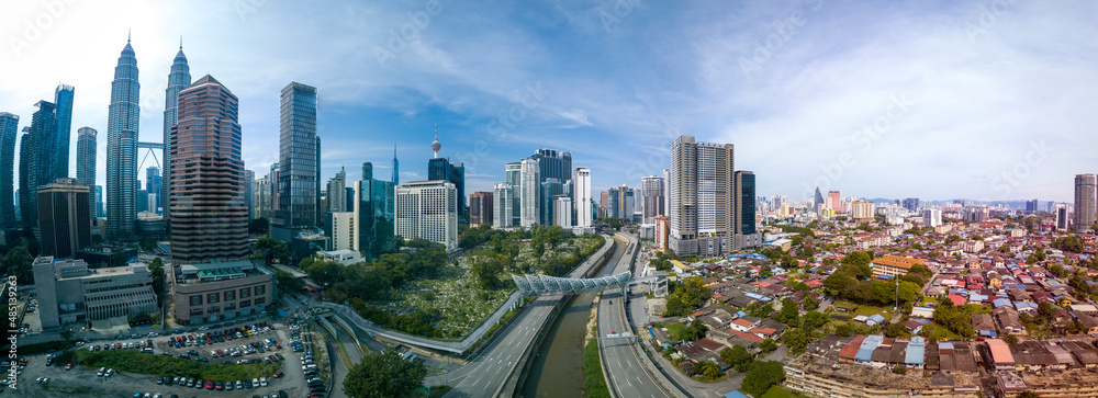 Modern Skyscraper and Traditional Housing Area at Kuala Lumpur, Malaysia
