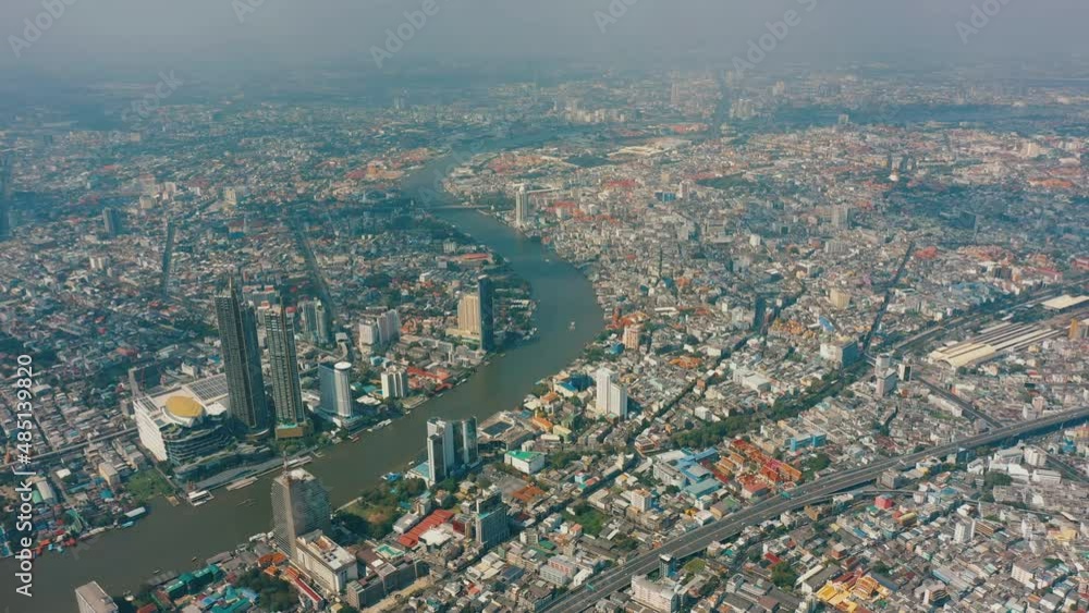 Aerial view of Bangkok city, Thailand. Chao Phraya river, financial district and business centers, skyscrapers and high-rise office buildings, street highways Aerial view of Bangkok city, Thailand. Chao Phraya river, financial district and business centers, skyscrapers and high-rise office buildings, street highways