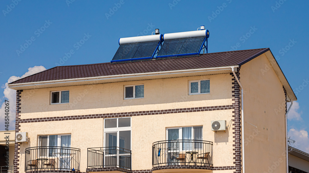 Solar water heater on roof top, beautiful blue sky background Stock ...