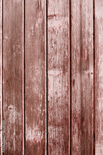 Weathered pink wooden boards background. Vertical vintage surface for mother's day greetings. Top view.