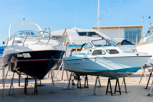 Fotografie Boat on the stand in the marine workshop on the beautiful sunny day, a place for