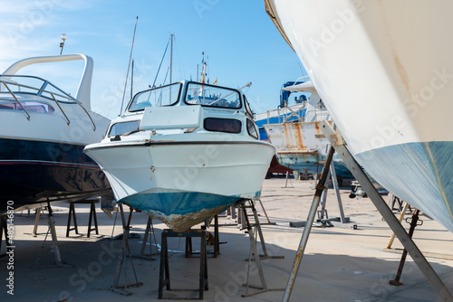 Wallpaper Mural Boat on the stand in the marine workshop on the beautiful sunny day, a place for maintenance and parking  boats Torontodigital.ca