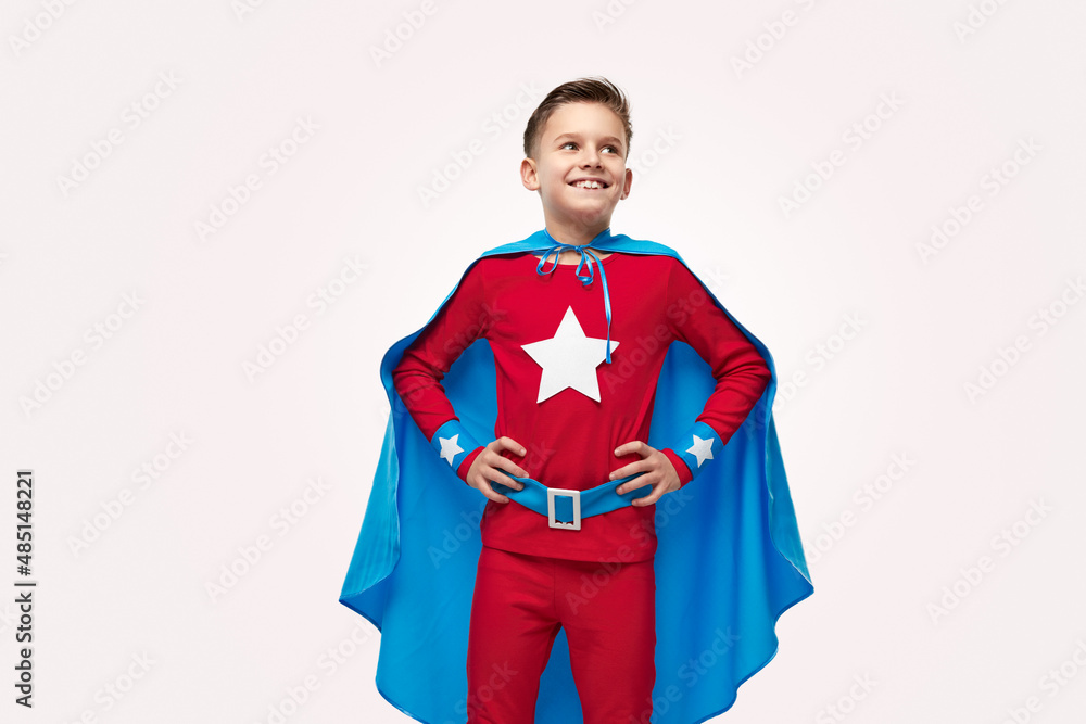 Proud smiling superhero child in costume Proud smiling superhero child in costume