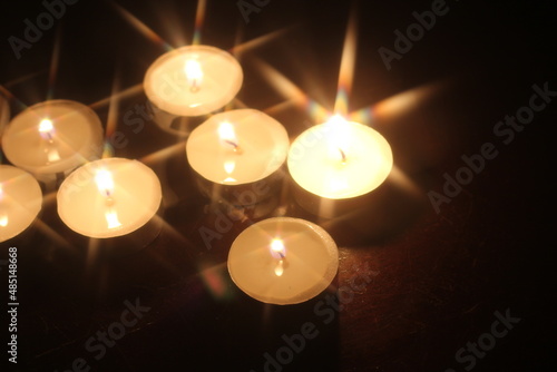 Wallpaper Mural Light several candles on a wooden table Torontodigital.ca