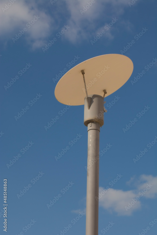 metal lamppost with blue sky in the background metal lamppost with blue sky in the background