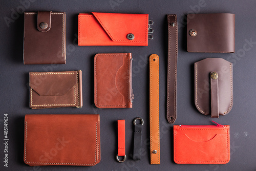 a set of handicrafts made of leather on a black background. flatlay