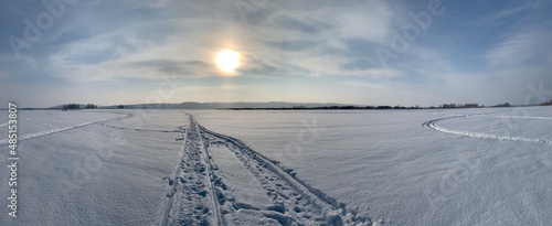 snowmobile tracks in the snow