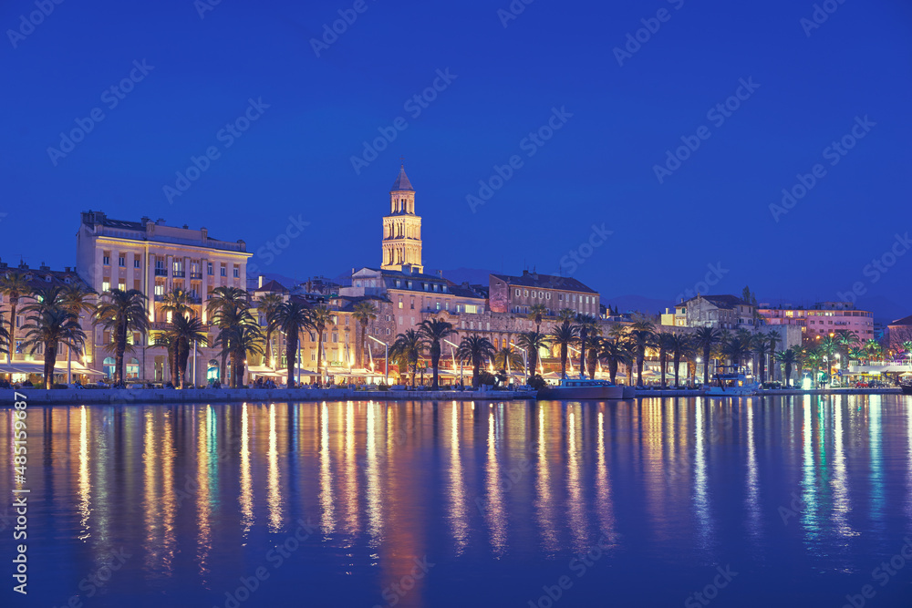 Travel by Croatia. Beautiful landscape with Split Old Town on sea shore at night.