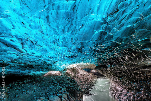 An icy river carries melt water through an ice cave in the glacier. Vatnajokull glacier in southeast Iceland.