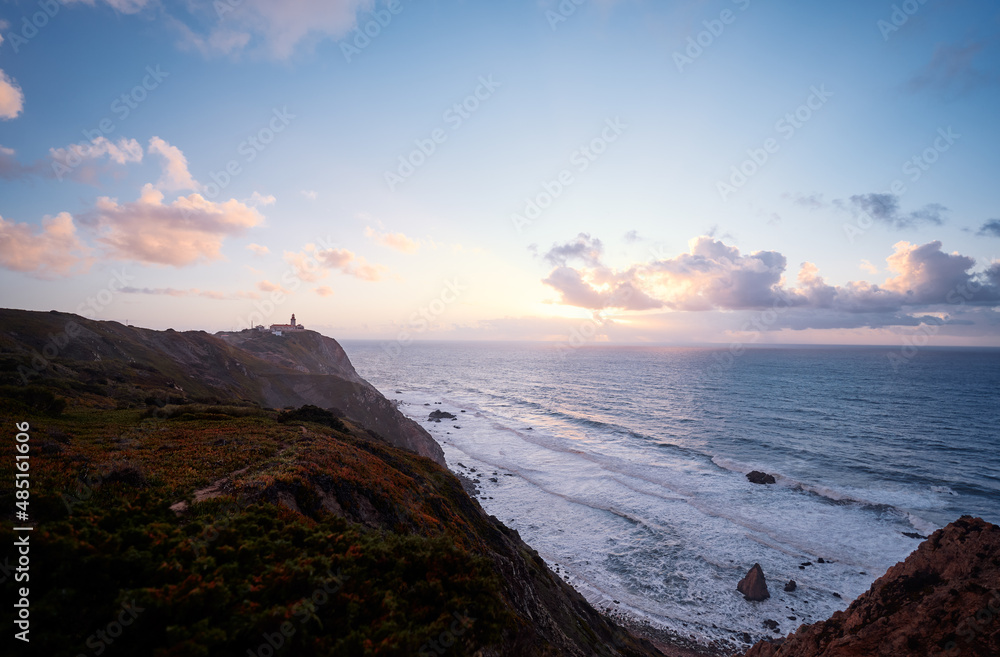 Rocks and waves at coastline picturesque landscape. Cabo da Roca, Portugal.