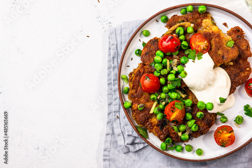 Chickpea pancakes with green peas. Vegetarian superfood, healthy brunch idea
