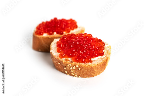 Red caviar isolated on a white background. Sandwiches with red caviar.