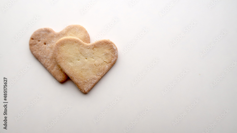 Two ruddy warm cookies on a white background for valentine's day Two ruddy warm cookies on a white background for valentine's day