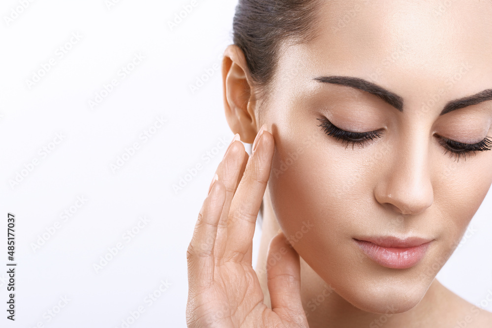Facial Care. Female Applying Cream.Portrait Of Young Woman With Cosmetic Cream On Skin. Closeup Of Beautiful Girl With Beauty Product On Soft Skin, Natural Makeup Touching Face. High Resolution.Spa. Facial Care. Female Applying Cream.Portrait Of Young Woman With Cosmetic Cream On Skin. Closeup Of Beautiful Girl With Beauty Product On Soft Skin, Natural Makeup Touching Face. High Resolution.Spa.