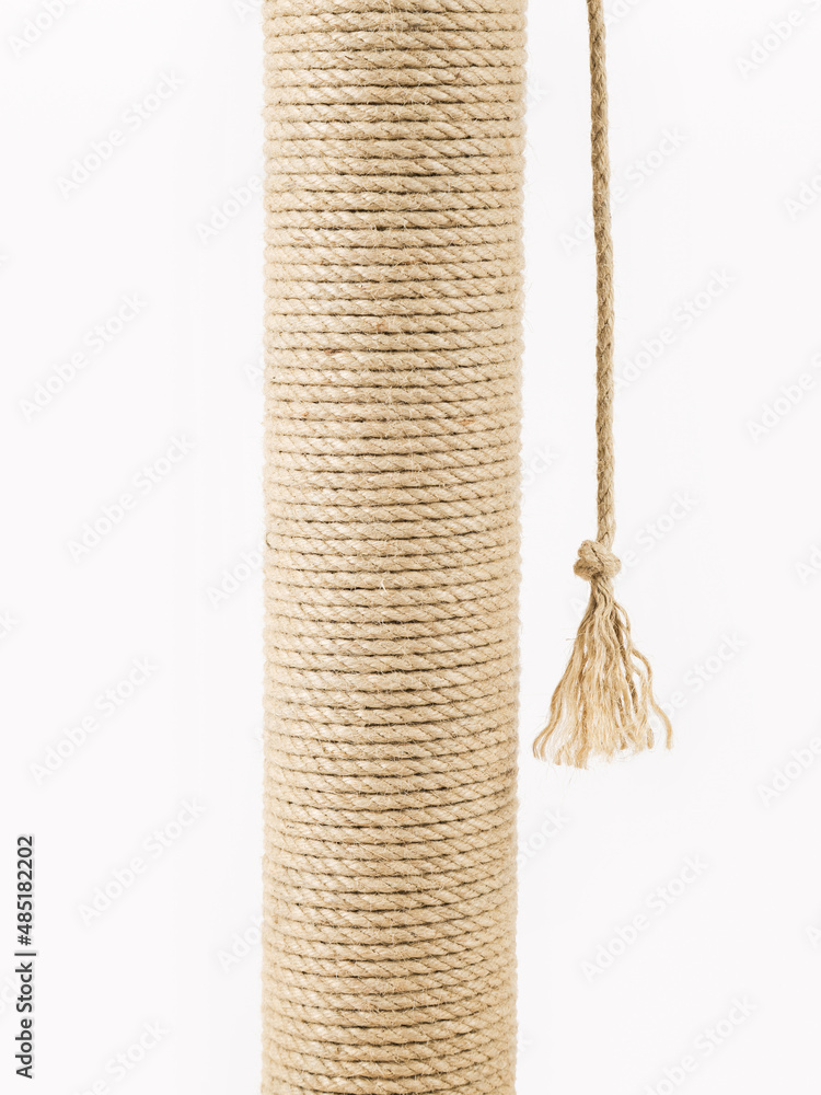 A scratching post for cats on a white background. Close-up. A scratching post for cats on a white background. Close-up.