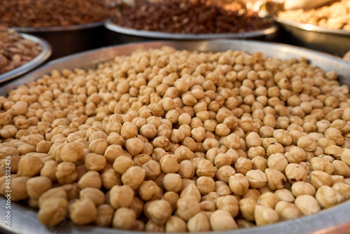 hazelnuts in bowl at street market. High quality photo