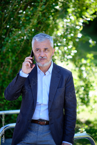 Mature man talking on the phone