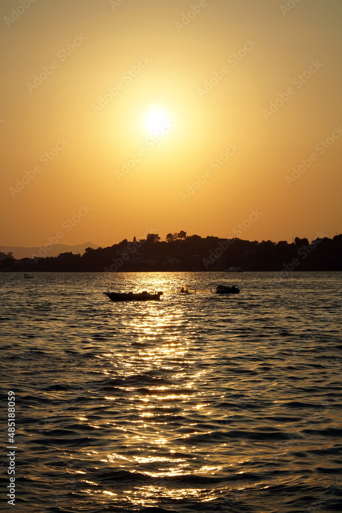 Sunset over the Aegean Sea. View from the embankment of the city of Fethiye.