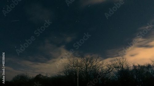 wooden cross against the background of the night starry sky