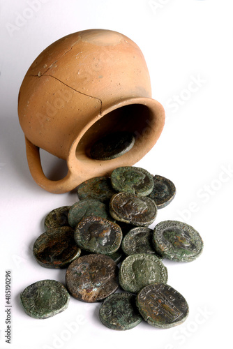 hoard of roman coins isolated on white background photo