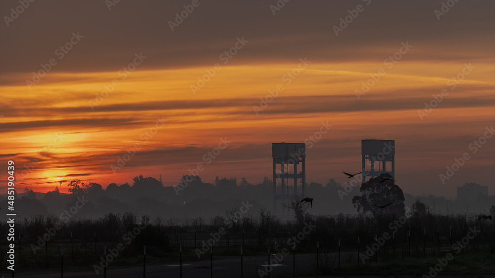 Fototapeta premium Sunrise with a beautiful colorful sky on the bridge towers 