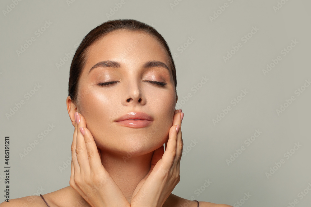 Young woman with beautiful face, eyes closed. Young woman with beautiful face, eyes closed.