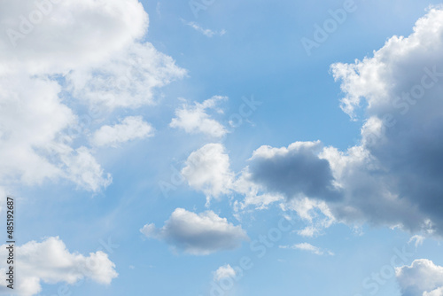 Blue sky background. Blue sky with clouds close up.