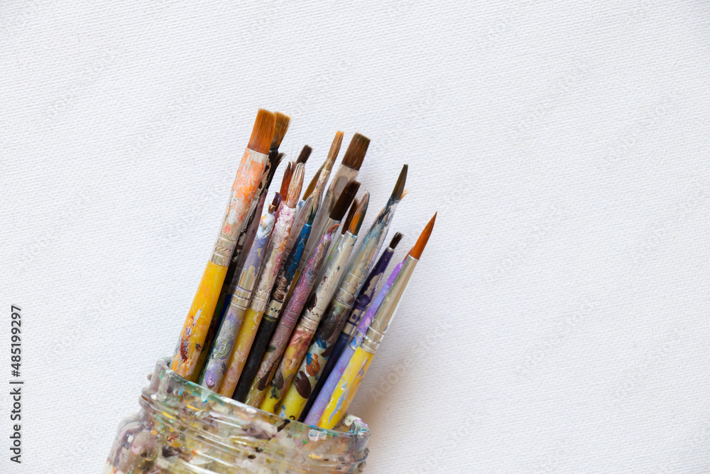Obraz premium brushes in watercolor paint on an isolated background closeup ,hobby and creativity