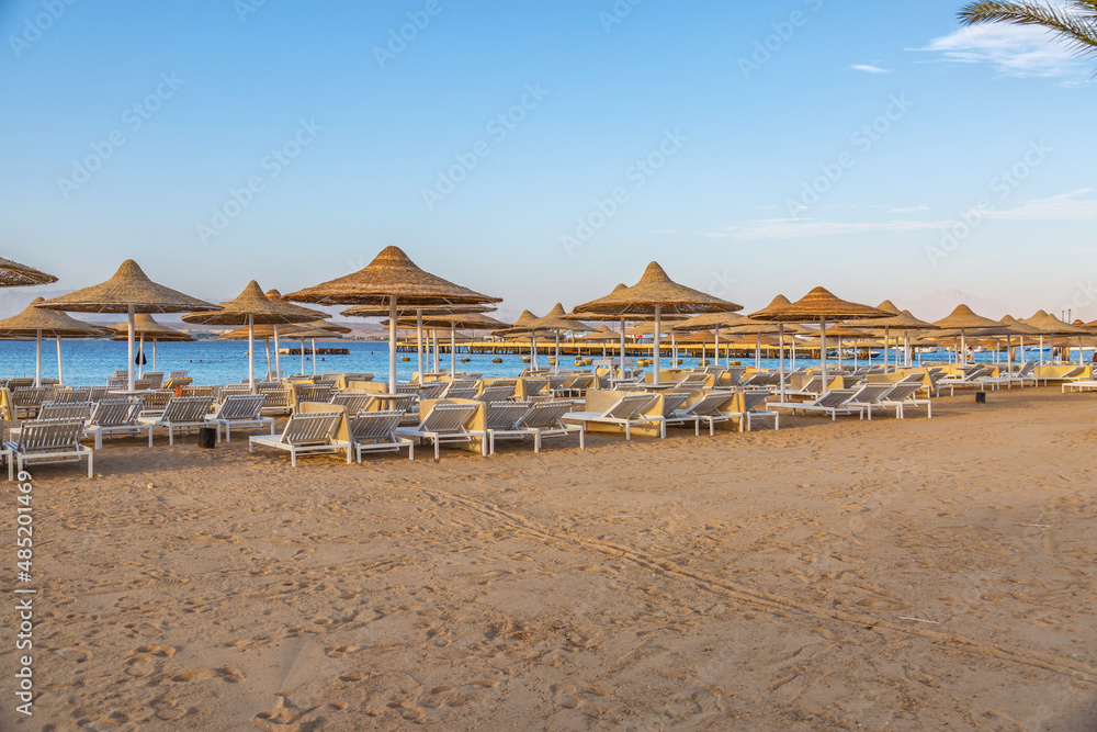  Hurghada, Egypt. .Swimming pool and accommodation at tropical resort. Buildings, swimming pools and a recreation area by the red sea.