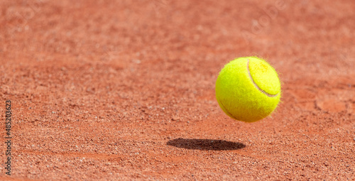 Tennis ball flying on air. Horizontal sport theme poster, greeting cards, headers, website and app © Augustas Cetkauskas