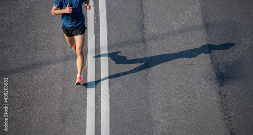 Close up of runner feet. Fitness background, close up of runner feet on the road. Horizontal sport theme poster, greeting cards, headers, website and app photo