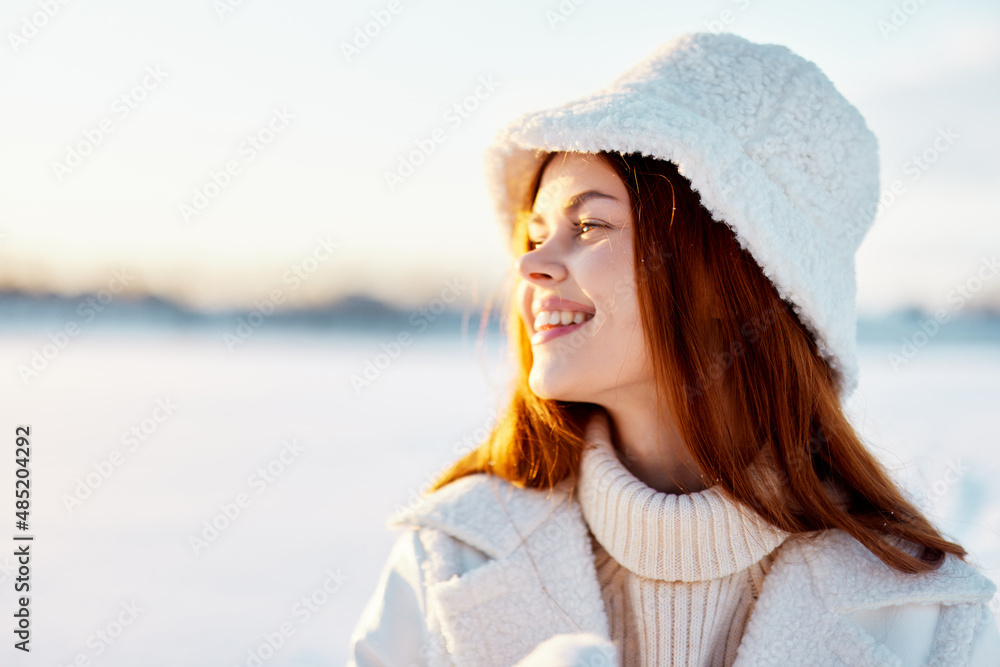 pretty woman in a white coat in a hat winter landscape walk Lifestyle pretty woman in a white coat in a hat winter landscape walk Lifestyle