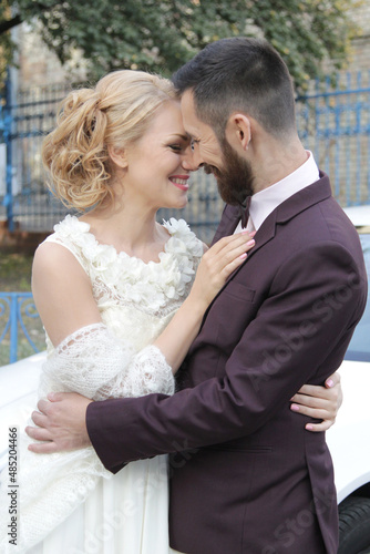  Loving adult couple. Bride and groom. Close-up. Smiling people. Beautiful young international family hugging. Love, hugs, tenderness, trust, honeymoon, February 14, wedding