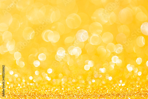 sparkles of yellow glitter abstract background. Copy space
