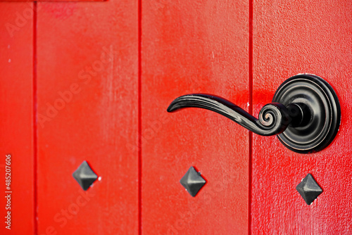 Antique design red wooden door and black iron Bridgnorth Door Handle photo