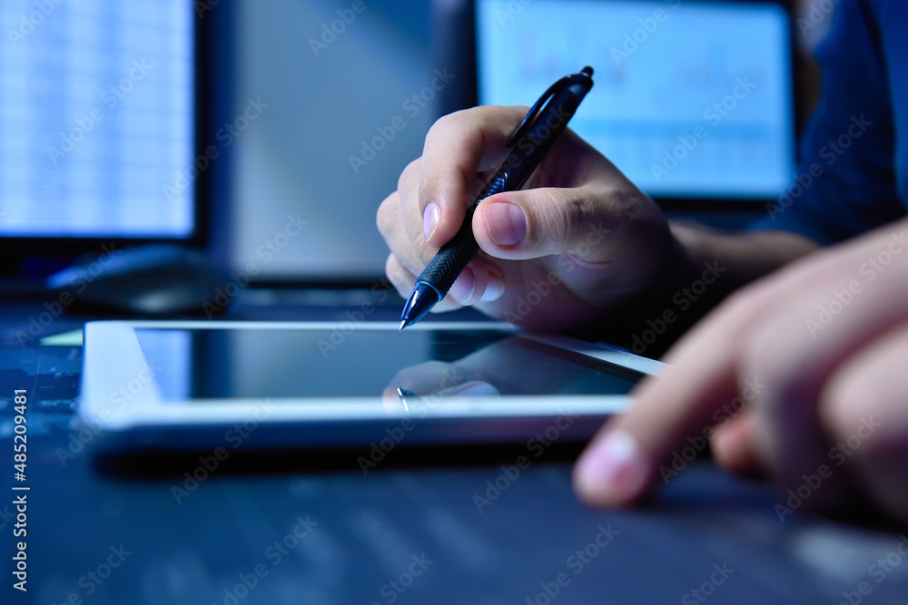Businessman hands with pen using digital tablet. Businessman hands with pen using digital tablet.