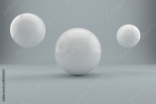 Suspended white balls on a white background. 3D image rendering.