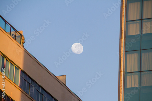 moonset in a beautiful blue sky in the neighborhood of Copacabana, Rio de Janeiro.