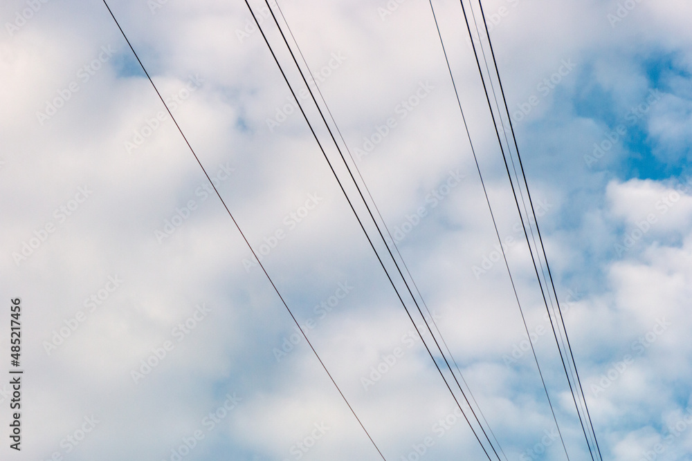 communication wires with a blue sky with clouds in Rio de Janeiro, Brazil. communication wires with a blue sky with clouds in Rio de Janeiro, Brazil.