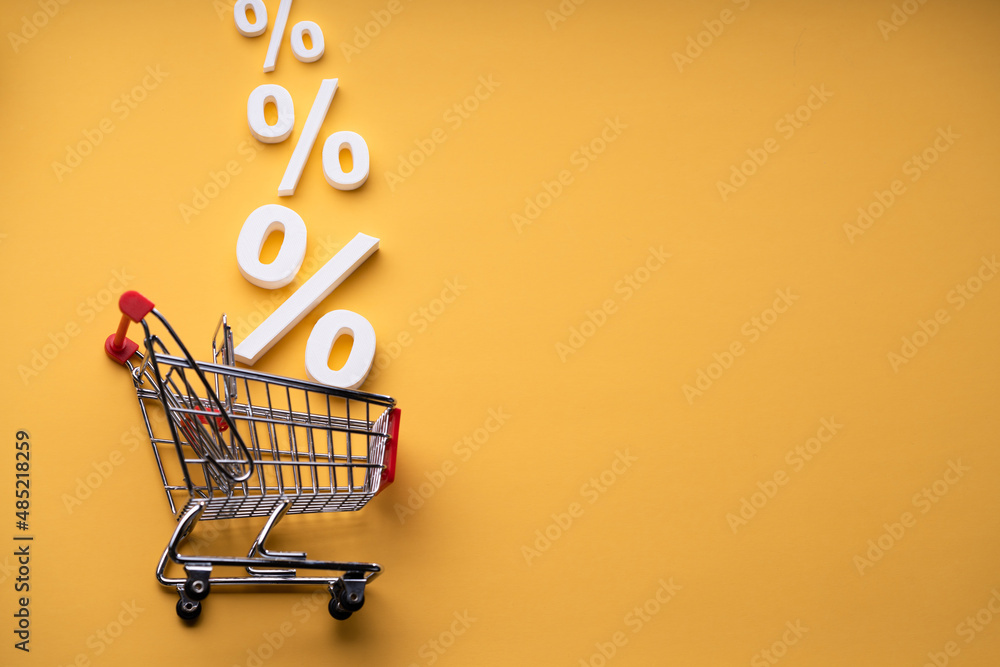 Sale Percents Falling Into Shopping Cart