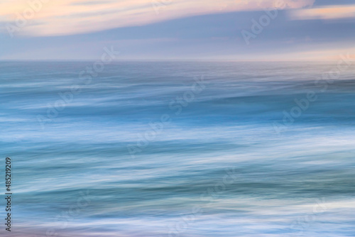 A panning abstract sunrise at the seaside © Merrillie