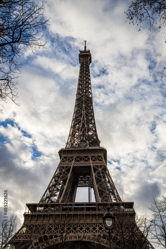 eiffel tower in paris close up with blue sky background