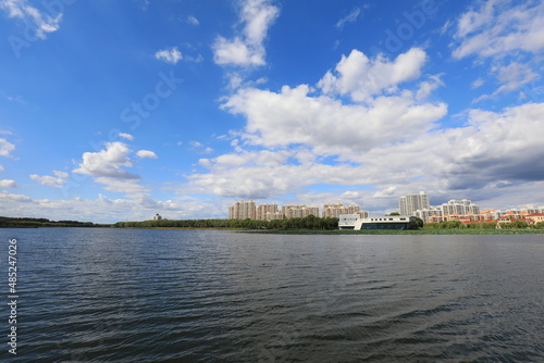 Sunny waterfront urban architectural scenery, North China