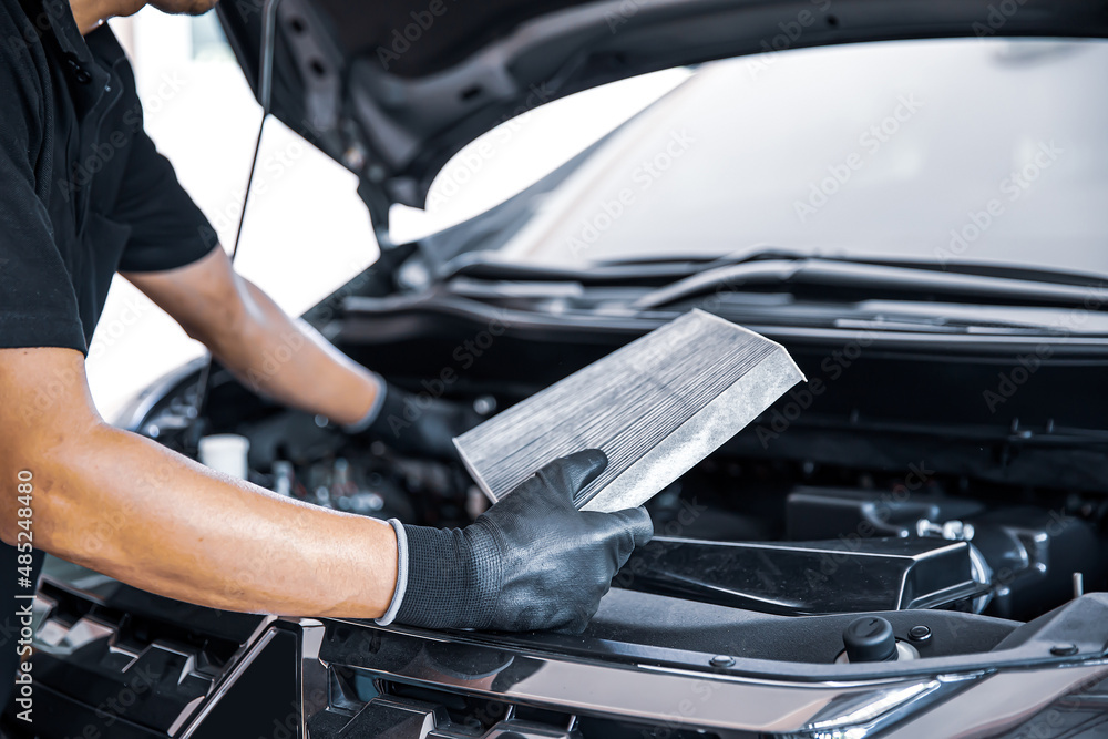 Auto mechanic hand holding car air filter. Concept of checking cleaning and  replacing car air conditioner filter and service maintenance. Photos |  Adobe Stock