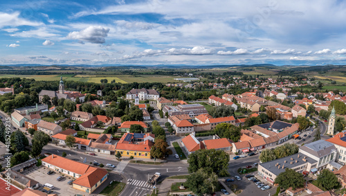 Aerial view of historic Szecseny town on the Hungarian Slovakian border with traces of medieval city wall, towers and white wall Forgach castle