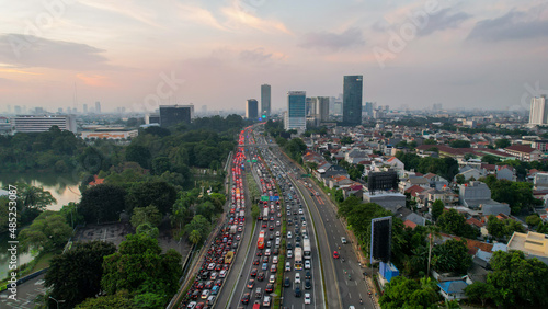 Aerial view of Jakarta highway traffic along Jendral Sudirman road in the afternoon on weekday. Jakarta, Indonesia, February 6 2022